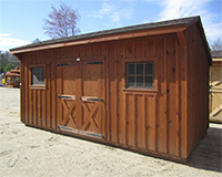 stained pine storage building