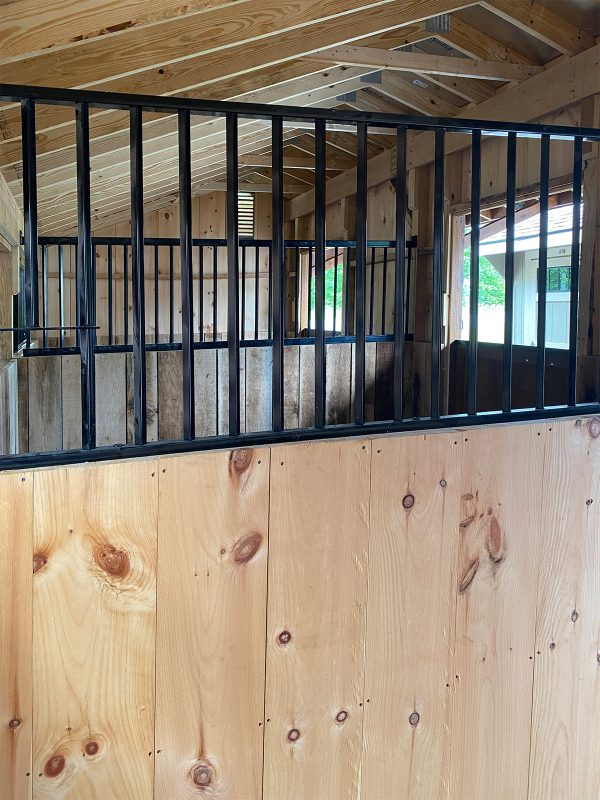 Metal grill in horse barn